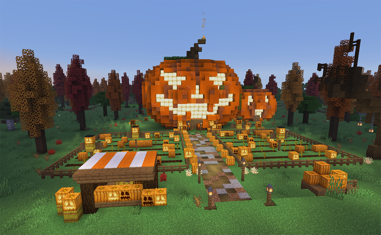 Giant jack o'lantern house in Minecraft with a chimney, smaller pumpkin cottage, and pumpkin patch