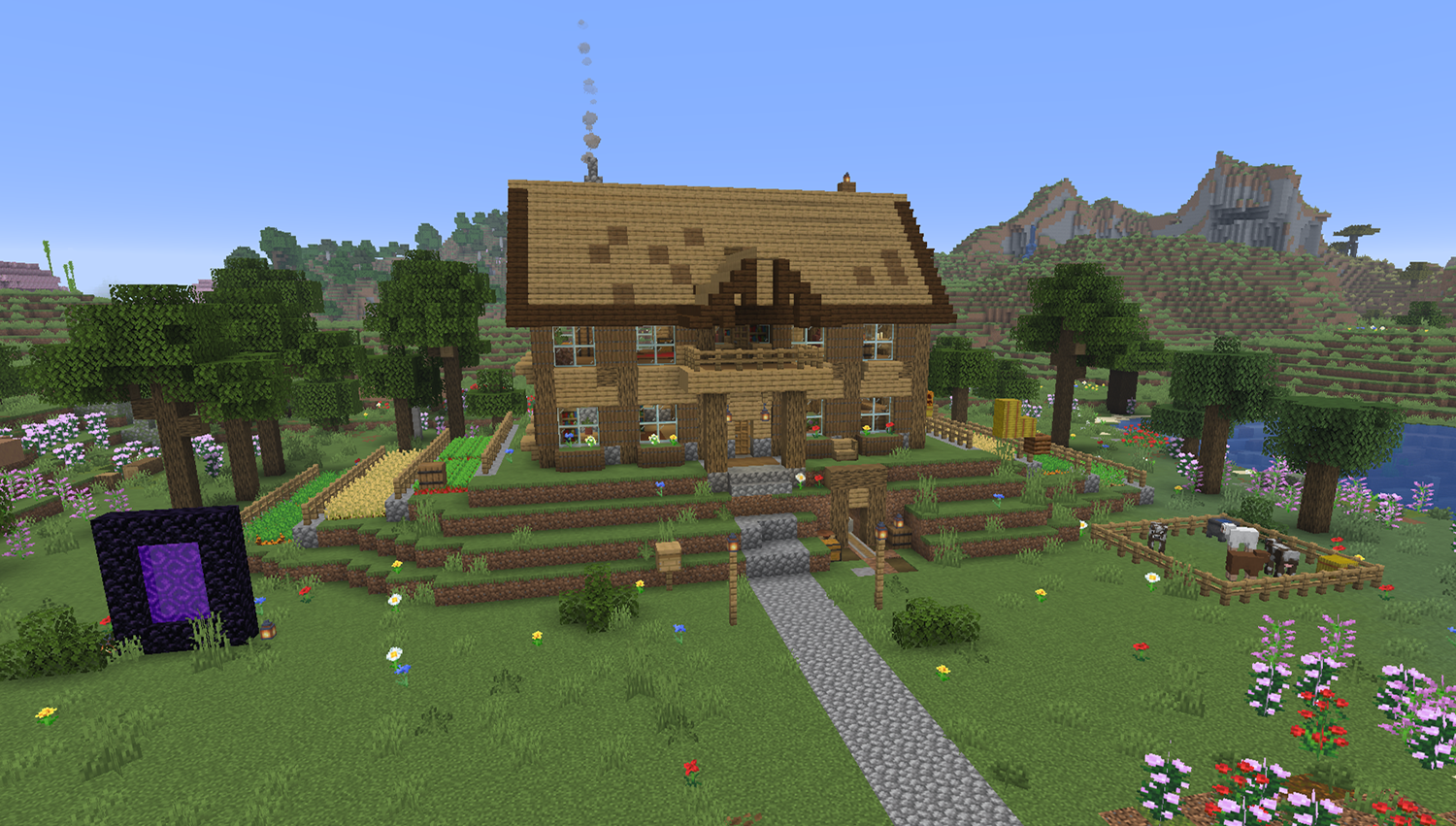 Large oak starter mansion in Minecraft built on a hill with a corner tower, farms down both sides, mine entrance in the hillside, and cow pen