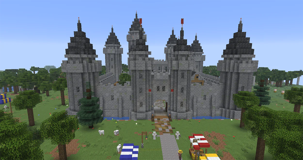 Minecraft stone castle with a moat, gatehouse and towers
