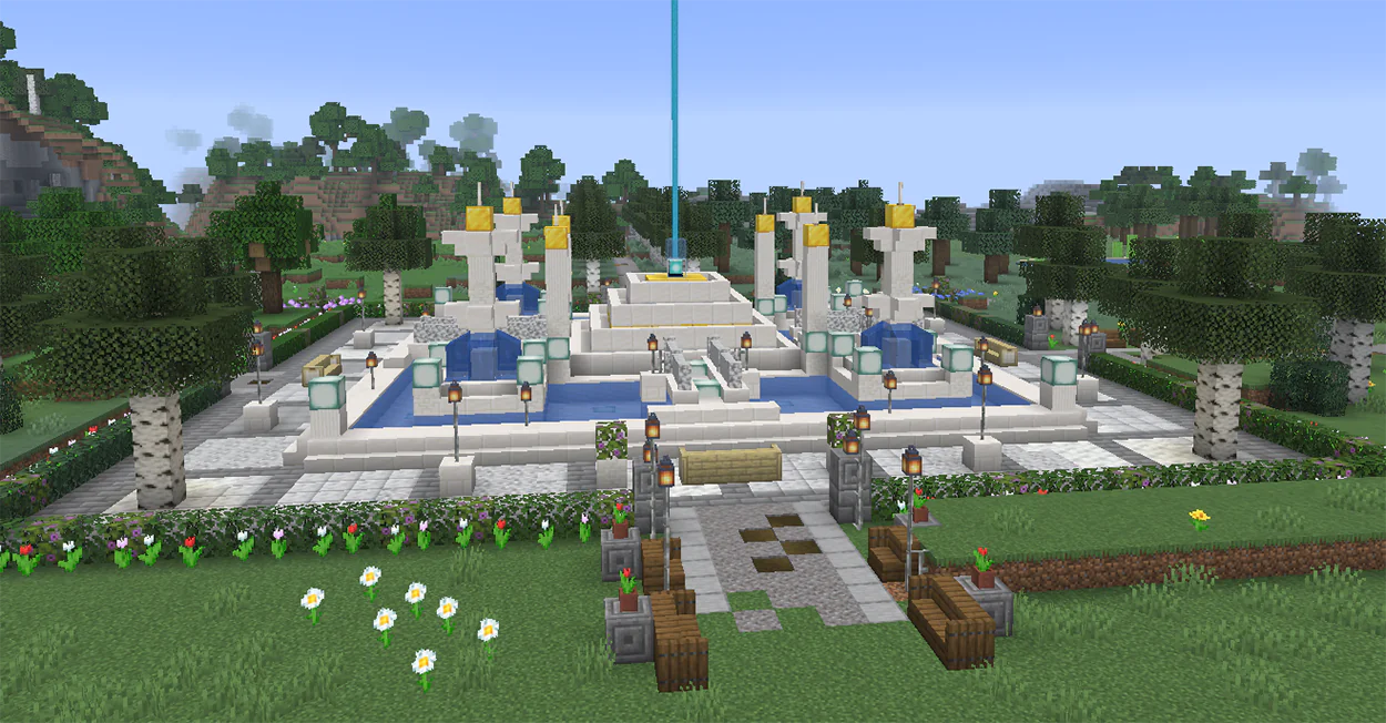 Minecraft fountain with a beacon in the middle and four quartz corner fountains