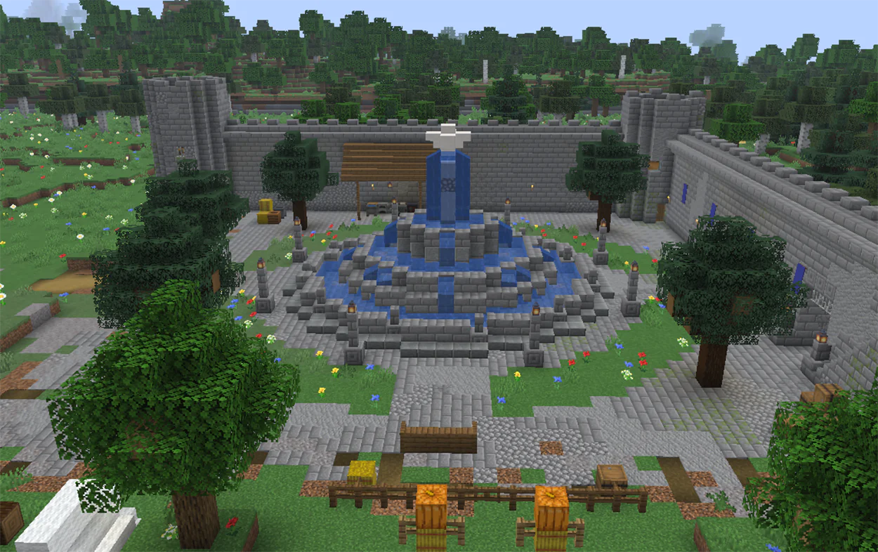 Large tiered stone brick fountain in a Minecraft castle courtyard