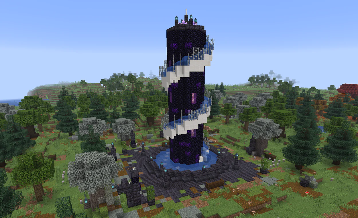 Tall obsidian spiral fountain in Minecraft with water running down a quartz channel