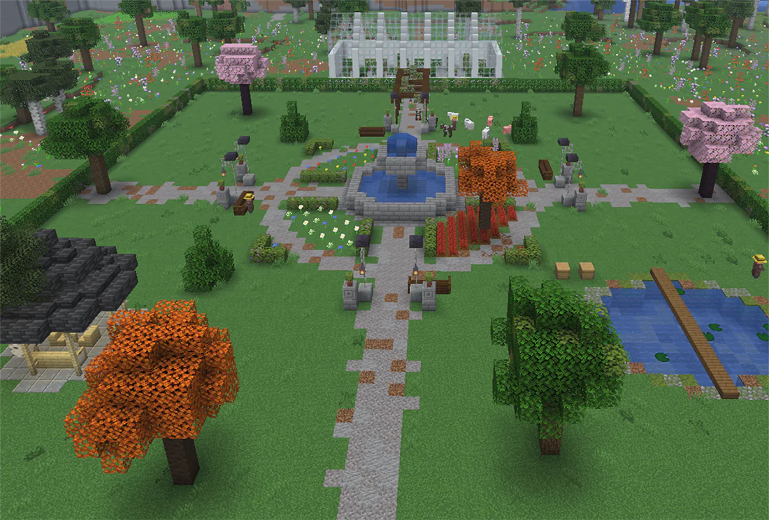 Minecraft garden with a tiered fountain, flower beds and an autumn bed of red shrubs