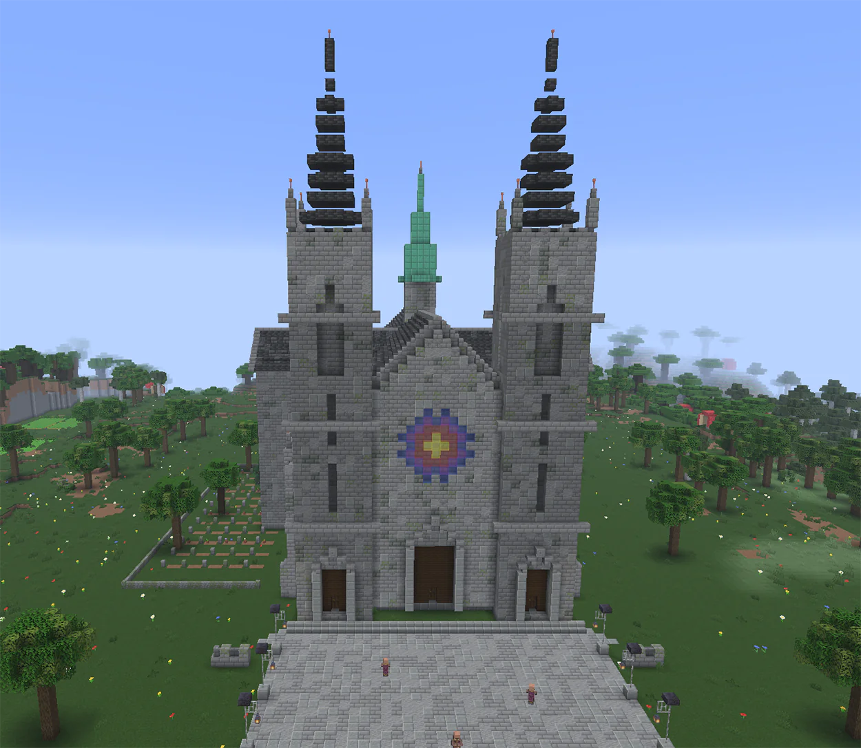 Minecraft gothic cathedral with spired towers and a stained glass window