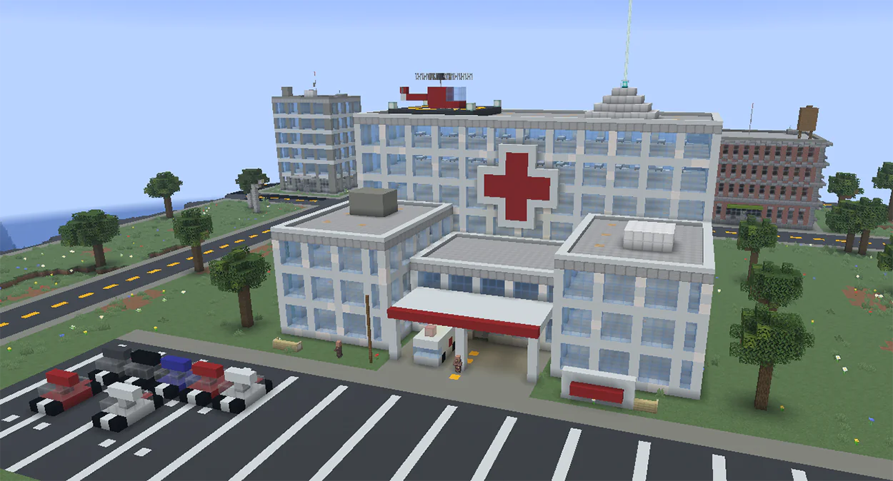 Minecraft white hospital with a red cross, ambulances, and helipad