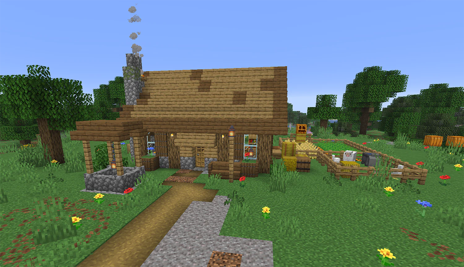 Simple medieval Minecraft starter house made of cobblestone and oak logs with trapdoor shutters, chimney, well, sheep pen, and fenced wheat farm