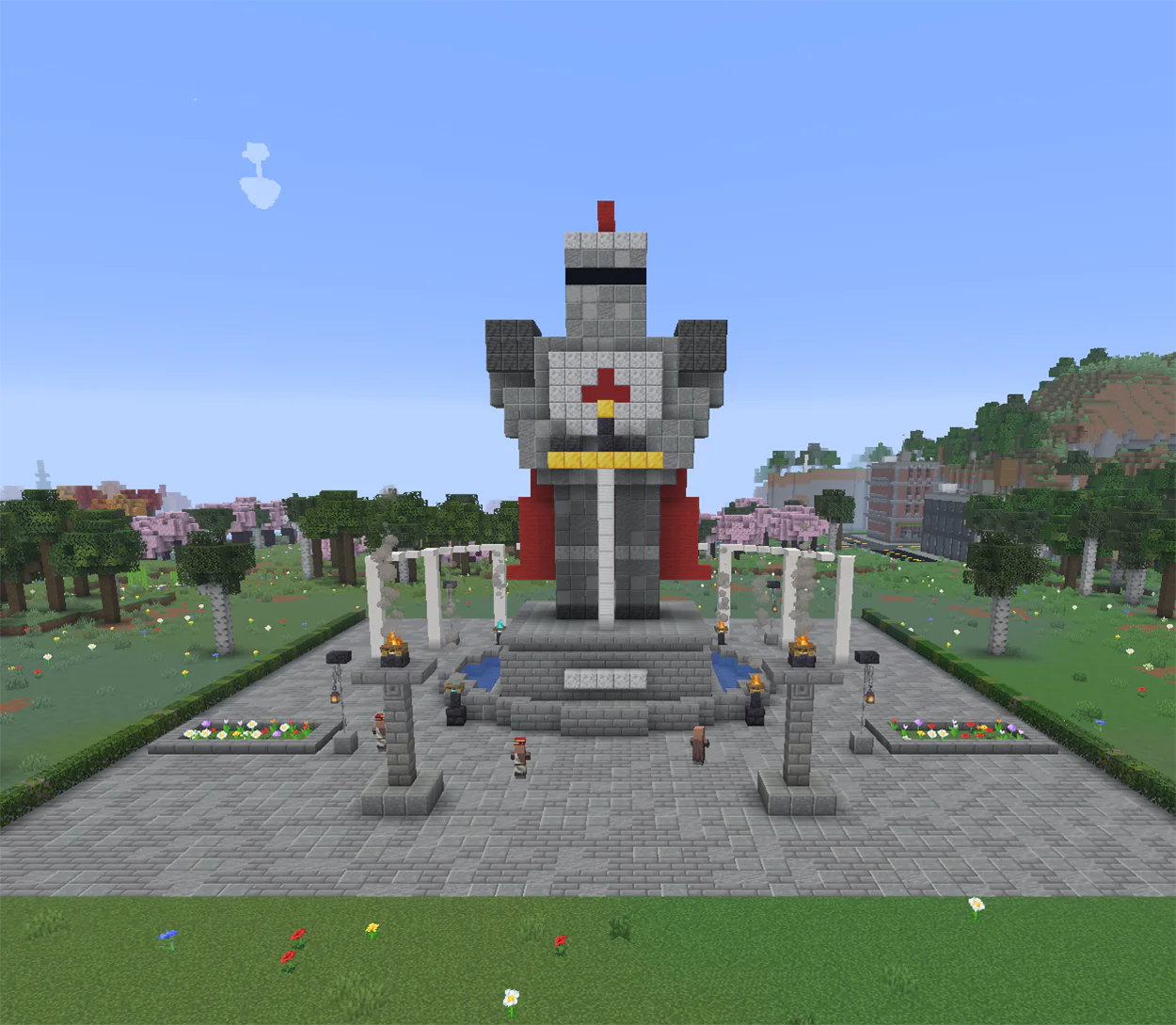 Minecraft knight statue holding a sword, standing in a fountain pool