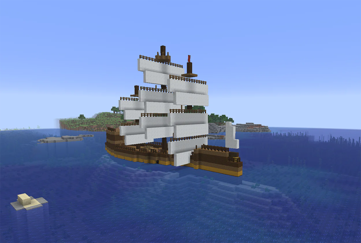 Minecraft sailing ship with white wool sails on the ocean