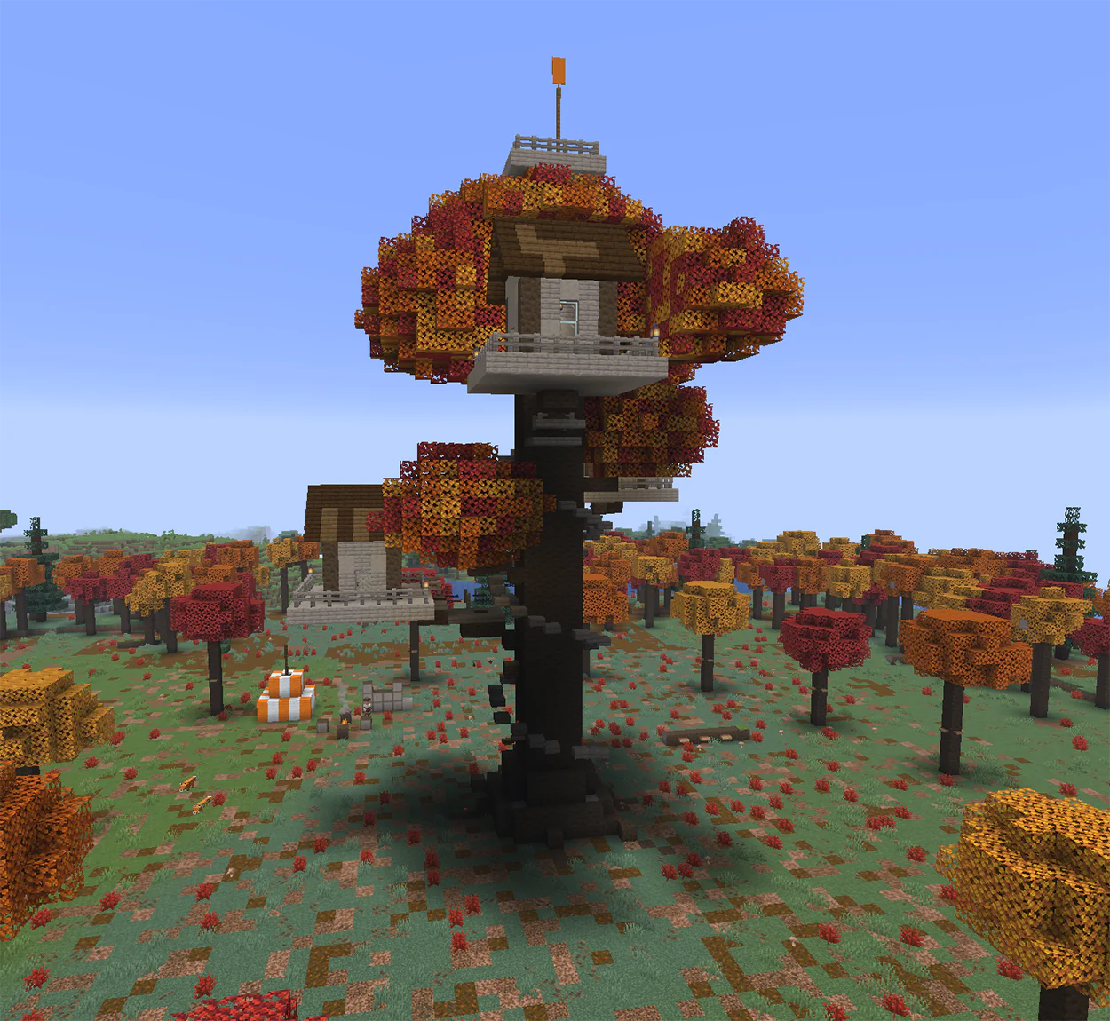 Minecraft tree house built from poplar wood in a giant tree with red, orange and yellow leaves